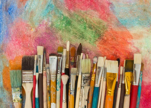 Brushes on a colorful background. — Stock Photo, Image