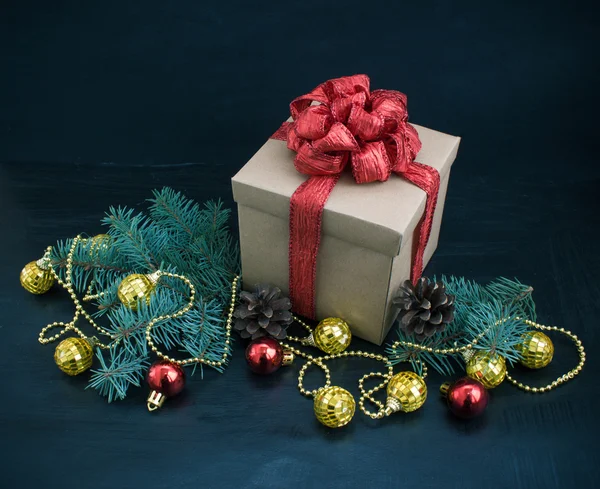 Christmas decoration with gift on dark background — Stock Photo, Image