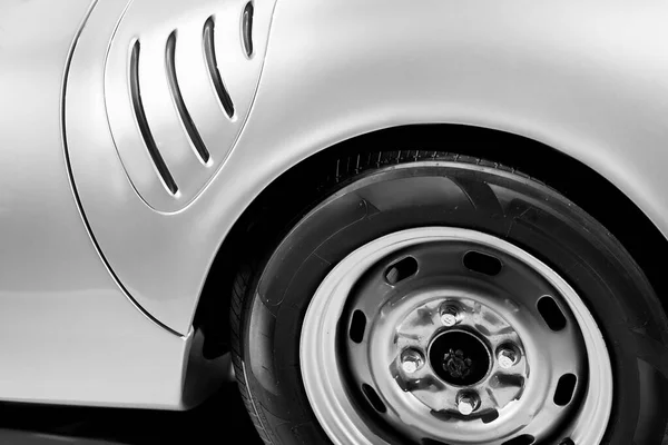 Rear fender of luxury vintage car. Old car classic design. Black and white image