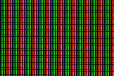 Aydınlatılmış LED paneli kırmızı, yeşil ve mavi noktalı makro yakın çekim.