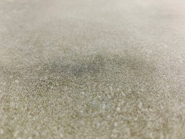 Sıcak tonda yumuşak, bulanık beton dokusu. Düşük açılı, yüzeysel odaklı. Sakin ve tarafsız bir ruh hali. Özgeçmiş, ürün modeli, minimal tasarım ve markalaşma kavramları için mükemmel.