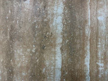 Sıcak kahverengi ve beyaz çizgileri olan doğal taş dokusuna yakın çekim. Keskin detaylar üzerine çekilmiş. Sakin, kırsal bir ruh hali. Arka planlar, tasarım konseptleri, doğa temaları, iç modeller için mükemmel.