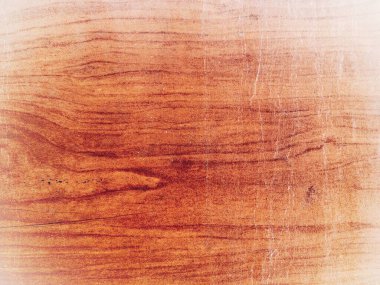 Sıcak ahşap doku, doğal tahıl desenleri ve ince çizikler, düz bir açıyla yumuşak ışıkta yakalanmış. Sakin, kırsal bir ruh hali. Özgeçmiş, tasarım, doğa ve zanaat kavramları için mükemmel..