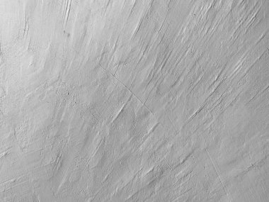 Doğal çizikler ve pürüzlü yüzeyi olan gri beton duvar dokusu, ışıkla bile doğrudan çekilmiş. Asgari ve nötr arka planlar, planlar, mimari ve modern tasarım temaları.