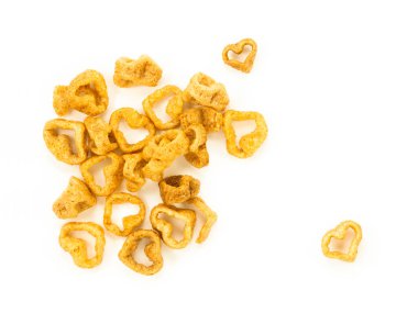 Crispy pork skin is a heart-shaped snack or eaten with papaya salad on a colored background. Thai food