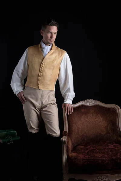 Handsome Regency Man Wearing Gold Waistcoat Breeches Standing Darkened Room — Stock Photo, Image