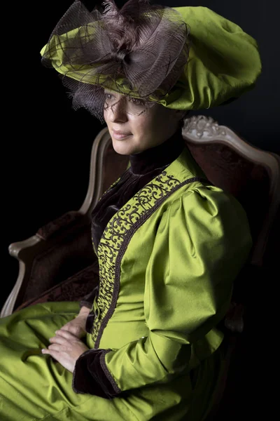 Victorian Woman Wearing Green Brown Silk Ensemble Sitting Ornate Red — Stock Photo, Image