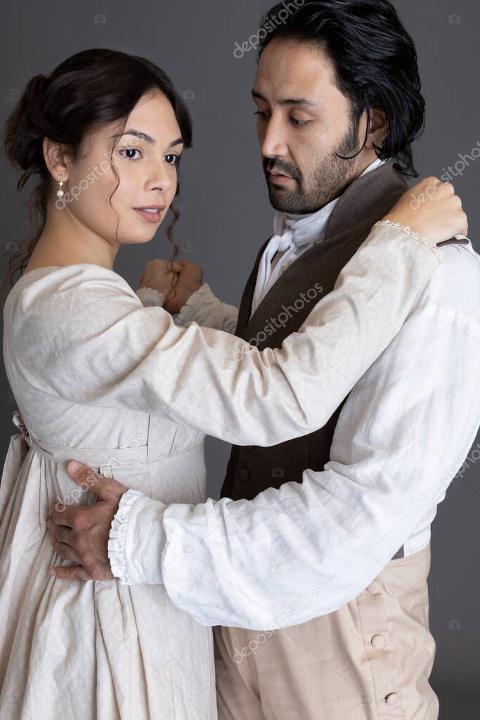 A Regency couple against a grey studio backdrop