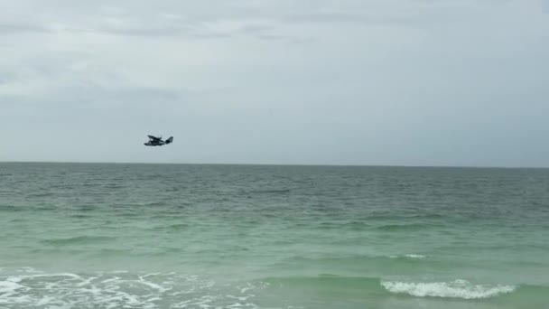 Three Small Seaplanes Flying Ocean Shore — Stock Video