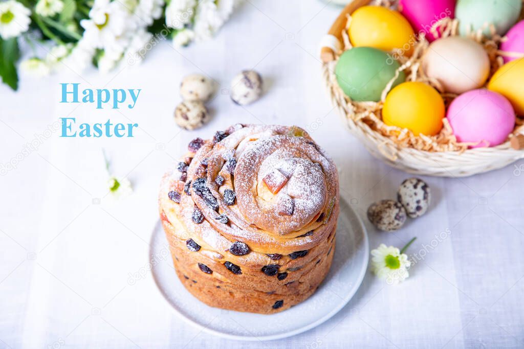 Craffin (Cruffin) with raisins and candied fruits. Easter cake Kulich and painted eggs. Easter Holiday. Close-up.