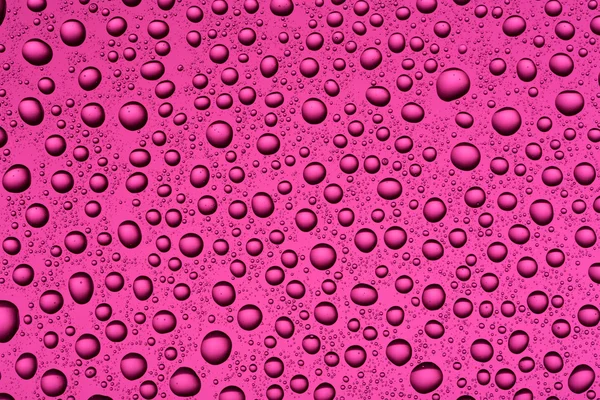 Drops of water on a colorful background — Stock Photo, Image