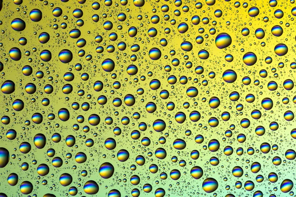 Drops of water on a colorful background — Stock Photo, Image