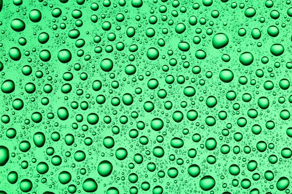 Drops of water on a colorful background — Stock Photo, Image