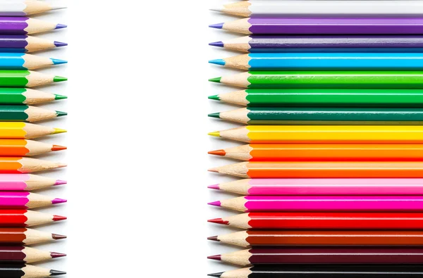 Colored pencils on white background Royalty Free Stock Photos