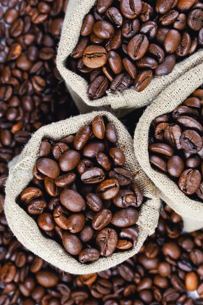 Grains of coffee in bags. Grains of coffee background