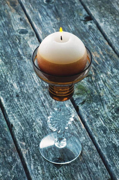 Burning candle in the shape of a ball — Stock Photo, Image