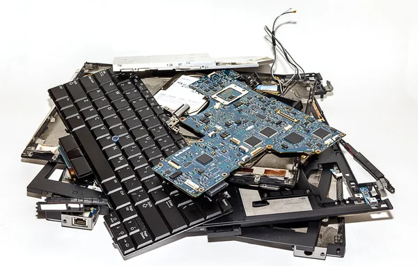 Laptop Disassembled into Broken Pieces Royalty Free Stock Images