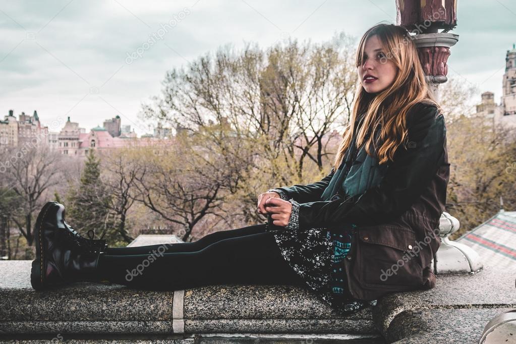 Girl sitting on edge of Belvedere Castle at Central Park in Manh
