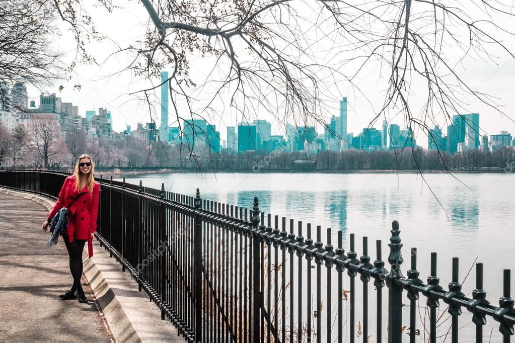Girl walking near river at Central Park in Manhattan, New York C