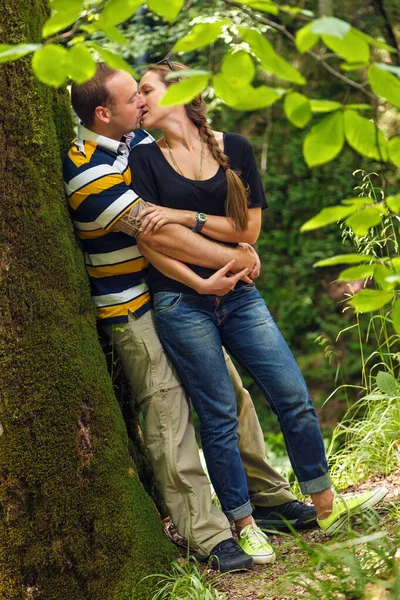 Young Happy Loving Caucasian Couple Embracing Kissing Outdoor Summer Forest — Stock Photo, Image