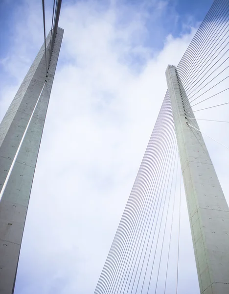 Bridge on the cloudy sky background