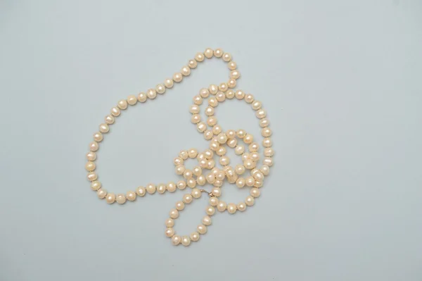 Pearl beads on white background — Stock Photo, Image