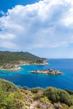 Lycian way hiking and trekking route with sea view in Turkish Mediterranean area with rocks, mountains. Mountain landscape image taken on the Lycian way hiking trail near Kas, Turkey.
