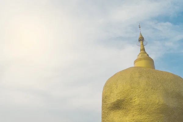 Thai Golden Buddhism rock in background blue sky — Stock Photo, Image