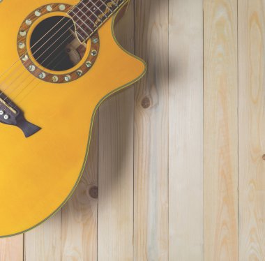 Ahşap panel kopya alanı ile akustik gitar.