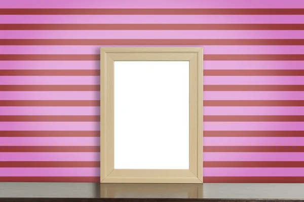 Дерев'яна рамка картини на рожевій смузі стіни — стокове фото
