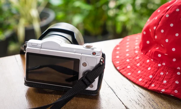 White Girly Camera with red fashion hat.