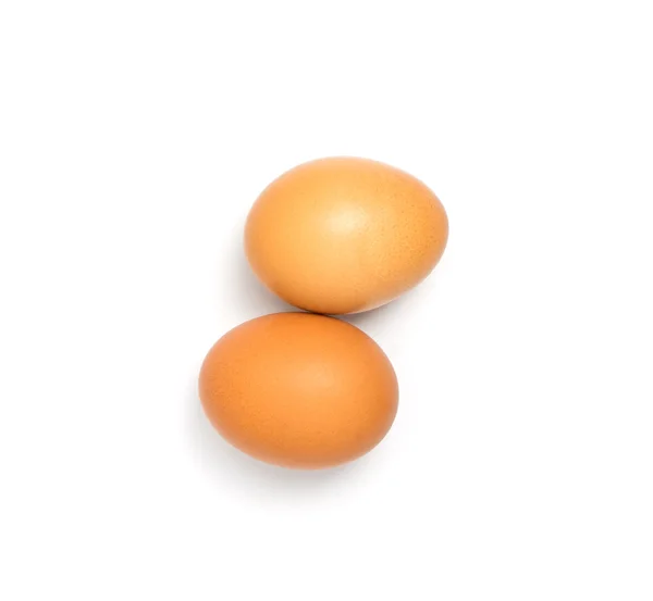 2 jajka, wyrównując na białym tle. — Zdjęcie stockowe