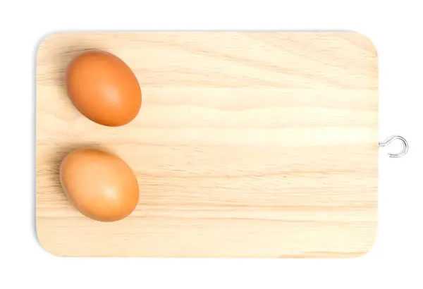 Ένα ζευγάρι των αυγών σε ένα φόντο ξύλινη θήκη απομονωμένες. — Φωτογραφία Αρχείου