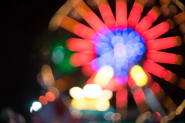 Amusement park ferris wheel light night blurred for background — Stock Photo, Image