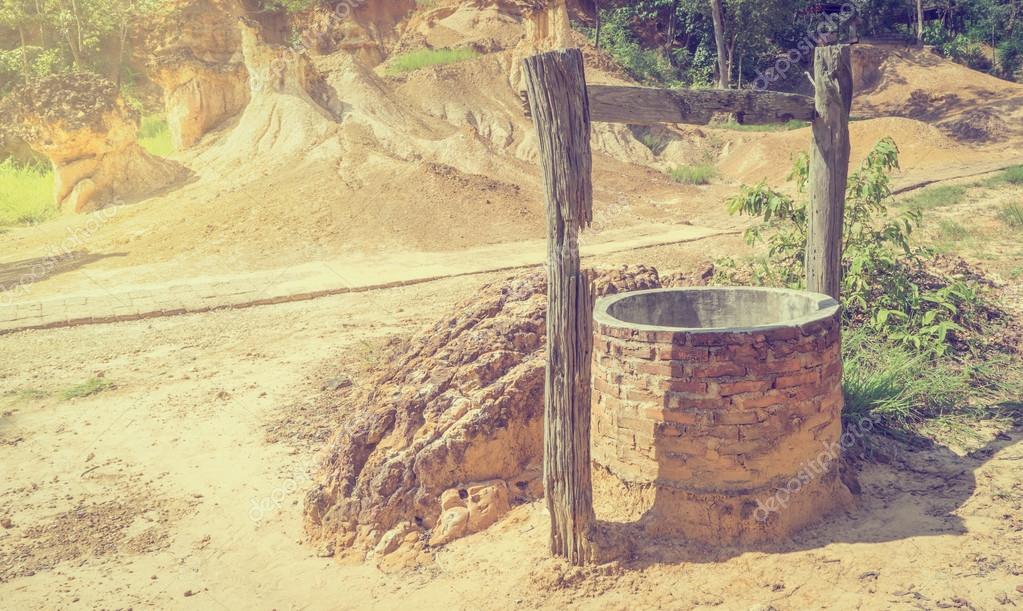 Water well in dry desert land — Stock Photo © junce11 120226324