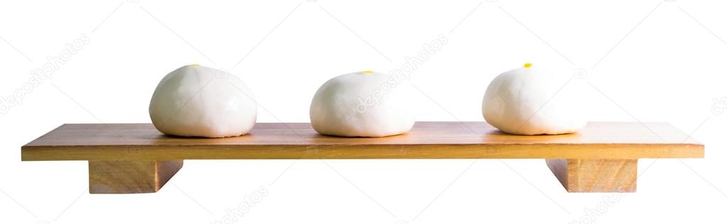 Chinese Buns on wooden tray isolated on white 