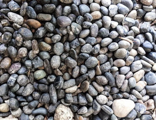 テクスチャと背景の灰色の岩地上を丸め. — ストック写真