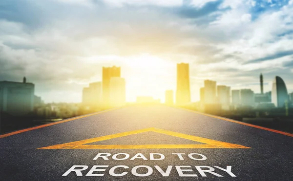 Road to recovery concept for business and health concept with golden city background.