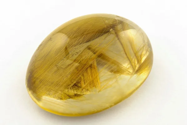 Rutilated kwarcowy cabochon — Zdjęcie stockowe