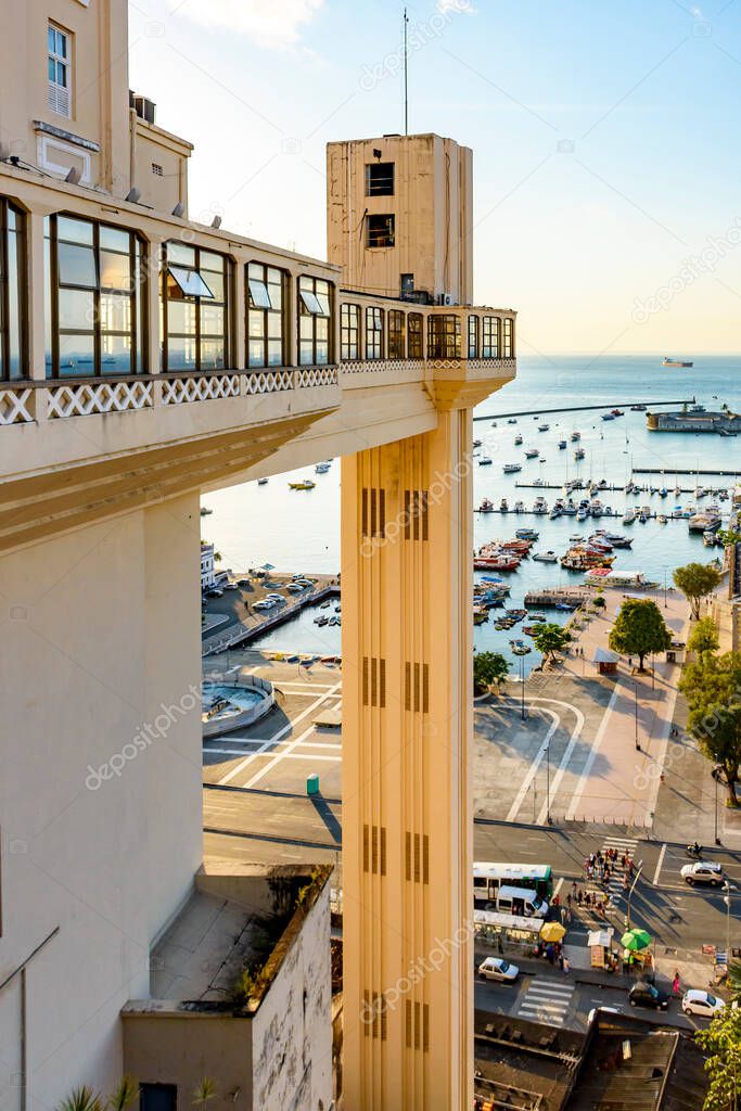 View of the bay of All Saints, Lacerda elevator and harbour at dusk in the famous city of Salvador, Bahia