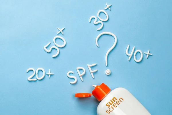 Sunscreen. How to choose the degree of protection of SPF for adults and children. Cream in the form of question mark and the inscription SPF on blue background with white tube. Concept of how to
