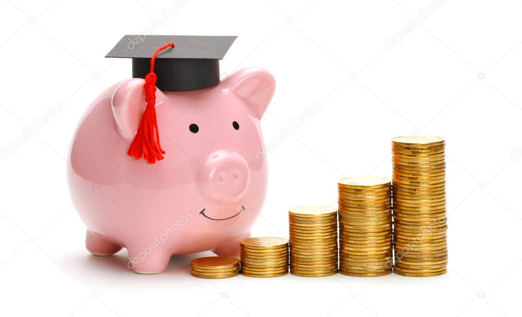 Piggy bank in graduate cap near stack of coins. Savings for education. Higher education prices