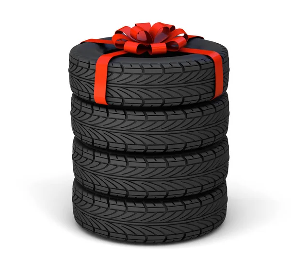 Neumático como regalo. Conjunto de tres neumáticos, uno atado con una cinta de regalo roja con un lazo. aislado sobre fondo blanco. 3d renderizar Fotos De Stock Sin Royalties Gratis