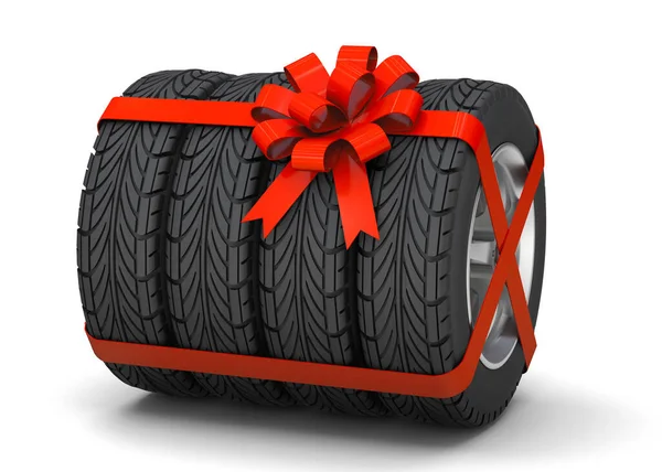Neumáticos como regalo. Los neumáticos con discos están atados con una cinta de regalo roja. aislado sobre fondo blanco. 3d renderizar Imagen De Stock
