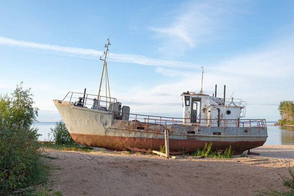 rusty old ship on the shore