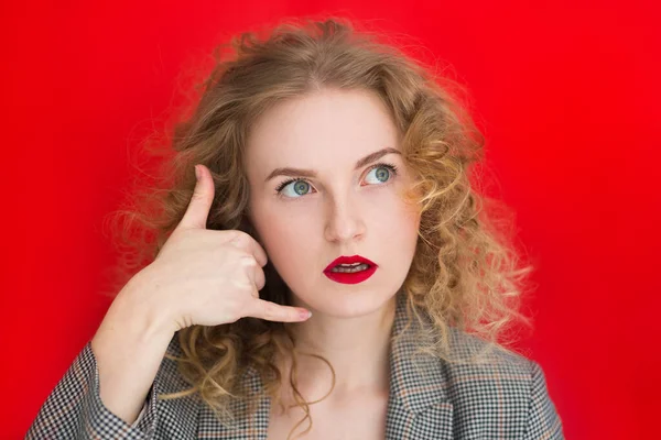 Young Woman Curly Hair Red Wall Making Phone Gesture Call — Stock Photo, Image