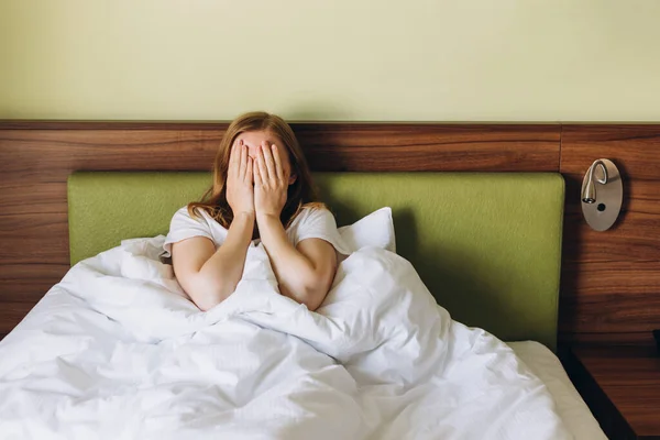 Close up young blonde woman feeling upset, sad, disappoint crying lonely in green bedroom. Emotional shock and life problems, domestic violence — Stock Photo, Image