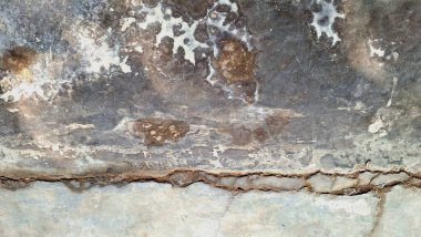 Hışırtılı beton doku, yıpranmış taş yüzey, eskimiş duvar arkaplanı, sert çimento kalıpları ve soyut endüstriyel doku tasarım elementi.