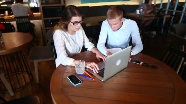 Young business team agree, resolve issues, press keyboard laptop