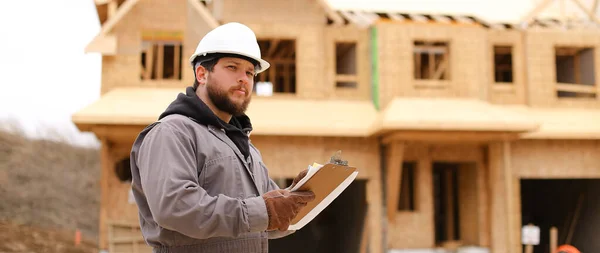 Banner of engineer drawing plan in notebook at construction site. — Fotografia de Stock